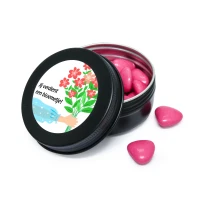 Zwart blikje met fuchsia roze snoepjes en sticker met de tekst jij verdient een bloemetje bedankje voor secretaressedag