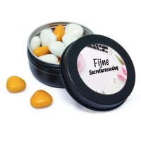 Zwart blikje met oranje snoepjes als bedankjes voor Secretaressedag