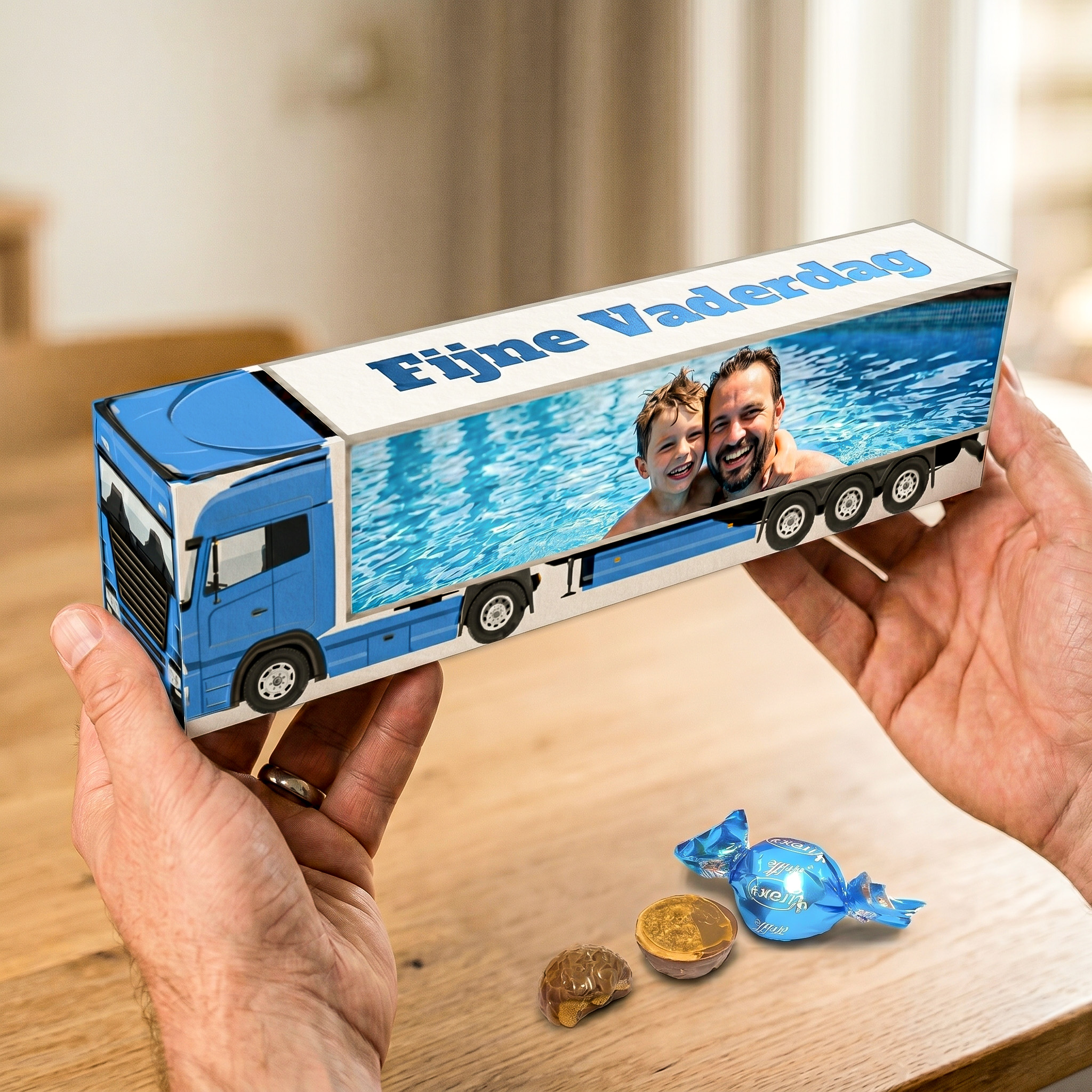 Fijne vaderdag vrachtwagen doosje met chocolade bonbons in handen